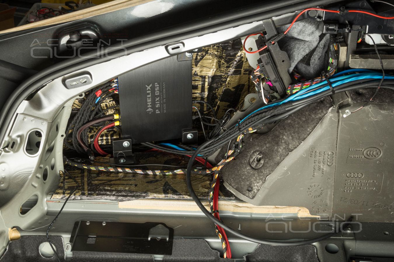 Технологии заводского монтажа: установка усилителей в Audi A7